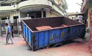 An overloaded tractor-trailer that got stuck on a road at Kamal Vihar in Jalandhar recently. 