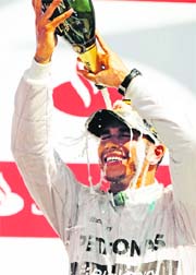 Mercedes Lewis Hamilton sprays himself with champagne after winning the British Grand Prix at Silverstone.