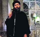 An image grab taken from a propaganda video allegedly shows ISIS chief Abu Bakr al-Baghdadi addressing Muslim worshippers.