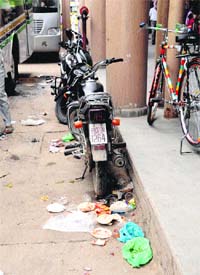 Two-wheelers parked unauthorisedly at the entrance of Shaheed Madan Lal Dhingra Inter-state Bus Terminus in Amritsar.