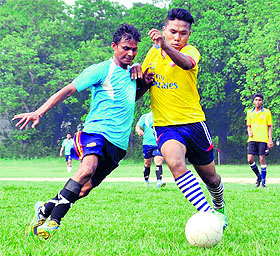 Players in action during the Ram Bahadur Chetri Memorial Football Tournament at the Forest Research Institute (FRI) playground in Dehradun on Monday.