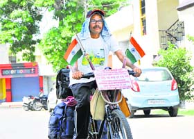 Bhau Saheb Bhawar on his cycle in Jammu on Monday