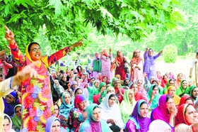 Anganwadi workers stage a protest in Srinagar on Monday
