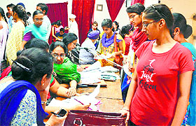 Students submit their documents for admission at the Government College 
