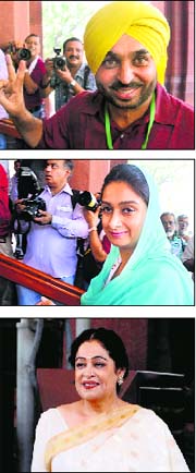 Bhagwant Mann of AAP, Harsimrat Kaur Badal of the SAD and Kirron Kher of the BJP at Parliament on Monday. 