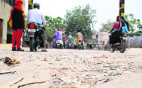 A bad stretch of road near the railway crossing No. 21 at Putlighar in Amritsar.
