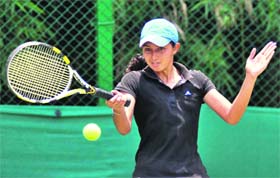 Rajbir returns a shot during a match of the CLTA-AITA tournament at the CLTA courts in Chandigarh on Tuesday.