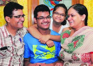 Hardik Verma, who scored the all-India rank 65 in the JEE (Mains), with his family at their residence in Sector 49, Chandigarh, on Tuesday. 