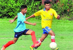 Players in action in a match in the Ram Bahadur Chettri Memorial Football tournament played at FRI grounds in dehradun on Tuesday.