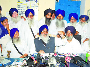 SGPC president Avtar Singh Makkar (centre) talks to the media in Sirsa on Tuesday.