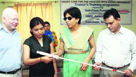Members of the NGO Saksham demonstrate the use of a smart cane in Jalandhar on Tuesday.