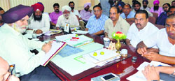 Mayor Harcharan Singh Gohalwaria meets Congress councillors at his office in Ludhiana on Tuesday. Photo : Inderjeet Verma