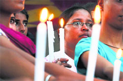 Students of the College of Fisheries take out a candlemarch at Guru Nanak Dev Veterinary and Animal Sciences University in Ludhiana on Tuesday. Tribune Photo: Himanshu Mahajan