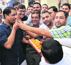 Anil Joshi, Minister for Local Bodies, along with party workers celebrates the election of Amilt Shah as BJP president in Amritsar on Wednesday.