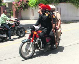 Cops take a triple ride on a bike in Bathinda.