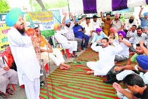 Members of the PRTC Workers Union (Azad) protest in Bathinda on Wednesday
