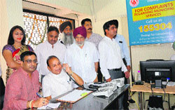 Mayor Harphool Chandra Kalyan receives a complaint after the launch of an MC helpline at Sector 17 in Chandigarh on Wednesday. Tribune Photo: S Chandan