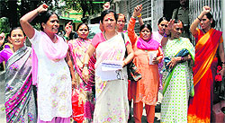 Members of the Janwadi Mahila Samiti hold a demonstration outside the office of the District Magistrate in Dehradun on Tuesday. A Tribune photograph