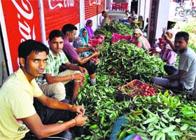 Litchi sellers separate good fruit from the bad one at Dagwar village near Dharamsala on Saturday