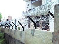 The barbed wire fence around the boundary wall of Jind PG College.