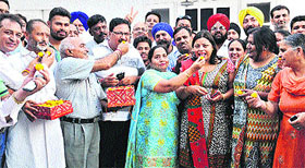  BJP leaders gather outside the residence of former minister Manoranjan Kalia in Jalandhar on Wednesday after the announcement on Amit Shah as the national president of the party.