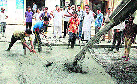 Mayor Sunil Jyoti inspects the road about which residents had complained in Jalandhar on Wednesday.