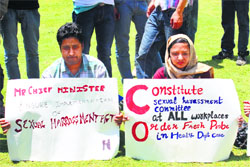 Activists hold placards during a sit-in to protest sexual harrasment of female paramedics in Srinagar on Wednesday. A Tribune Photograph