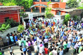 Residents and relatives of the victim stage a protest outside a school at Sunet village