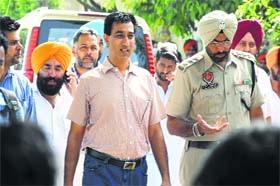 DO Gurjit Singh with a police official outside the school