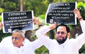 TMC members protest against the BJP on Wednesday