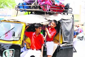 Schoolchildren packed in an auto-rickshaw in Bathinda on Thursday