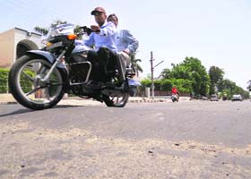 Scooterists face a tough time crossing the recently constructed speed-breakers on the main road in Model Town Phase-II