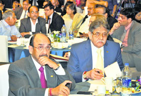 CII president Ajay S Shriram, Sumit Mazumder, president-designate, CII, and eminent industrialists watch the live telecast of General Budget 2014-15 at an interactive session in New Delhi on Thursday.