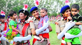 New recruits with their children after the passing-out parade of the 15th batch of 129 constables, including 96 males and 33 females, at the Police Lines in Sector 26, Chandigarh, on Thursday.