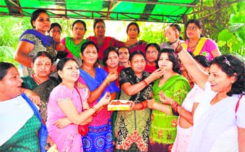 BJP womens cell activists distribute ladoos as Finance Minister Arun Jaitley produced the first Budget of the BJP- led Central Government in Haridwar on Thursday. 