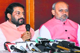 Haryana Lokhit Party president Gopal Kanda (left) talks to the media in Chandigarh on Thursday