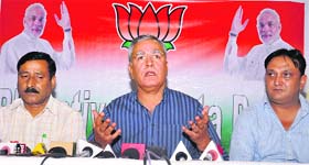 Former Inspector General of Police Farooq Ahmad Khan (centre) addresses a press conference in Srinagar on Thursday.