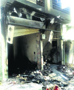 A gutted shop at BRS Nagar. Tribune photo