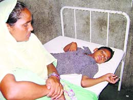 Victim Manpreet Singh with his mother Mohinder Kaur at the Sangrur Civil Hospital on Thursday.