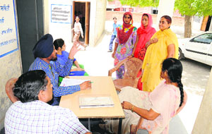 Block Primary Education Officer Darshan Singh Jidda conducts an inquiry at Government Elementary School at Lal Singh Basti in Bathinda on Friday