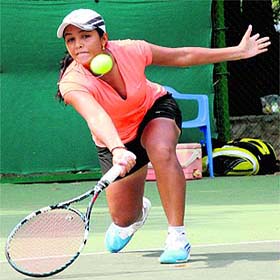 Anjali Thakur returns a shot during a match of the CLTA-AITA Mens and Womens Rs 1 lakh Tennis Tournament on Friday.