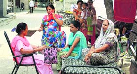 Jalandhar residents brave a power cut in Gandhi Camp on Friday.