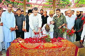 Chief Minister Omar Abdullah along with senior party leaders pays floral tributes to his grandmother Begum Akbar Jehan on her death anniversary at her grave in Srinagar on Friday.