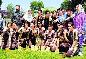 Mallinson Girls School team with the trophy after winning a football tournament in Srinagar on Friday.