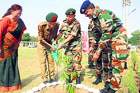 Lt Gen KH Singh, General Officer Commanding, White Knight Corps, plants a sapling at Army Public School in Nagrota on Friday.