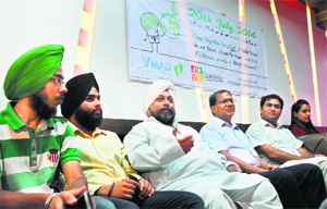 Member of an NGO, Sambhav Foundation, address a press conference about Earth Hour in Ludhiana on Friday.
