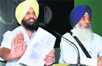 MLA Simarjeet Singh Bains (left) with his brother Balwinder Singh Bains in Chandigarh on Friday. Tribune photo