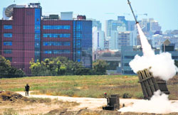 An Iron Dome launcher fires an interceptor rocket in the southern Israeli city of Ashdod on Friday. Reuters