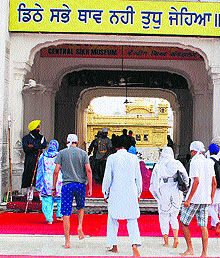 Devotees clean their feet at the entrance of the Golden Temple in Amritsar