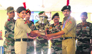 Maj Gen GS Chima, Additional Director General (ADG) of PHHP&C Directorate, gives winners trophy to  the Rohtak group at  NCC Academy, Ropar, on Saturday.